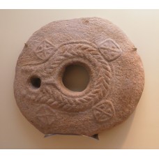 Circle stone with holes, solar disc, crosses 